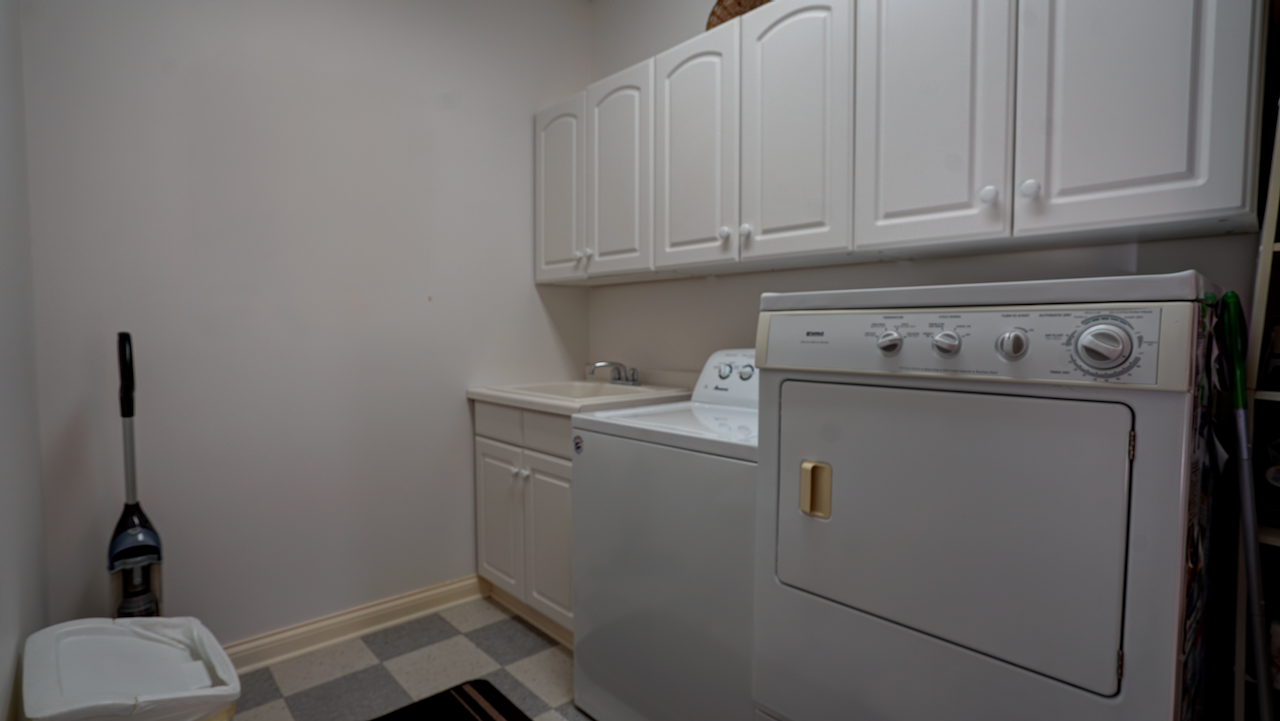 Located directly off the kitchen, the 11x7 mudroom and first-floor laundry combo serves as the ultimate transitional drop-zone.
Keep coats, boots, and daily gear organized and completely hidden from the main entertaining spaces.