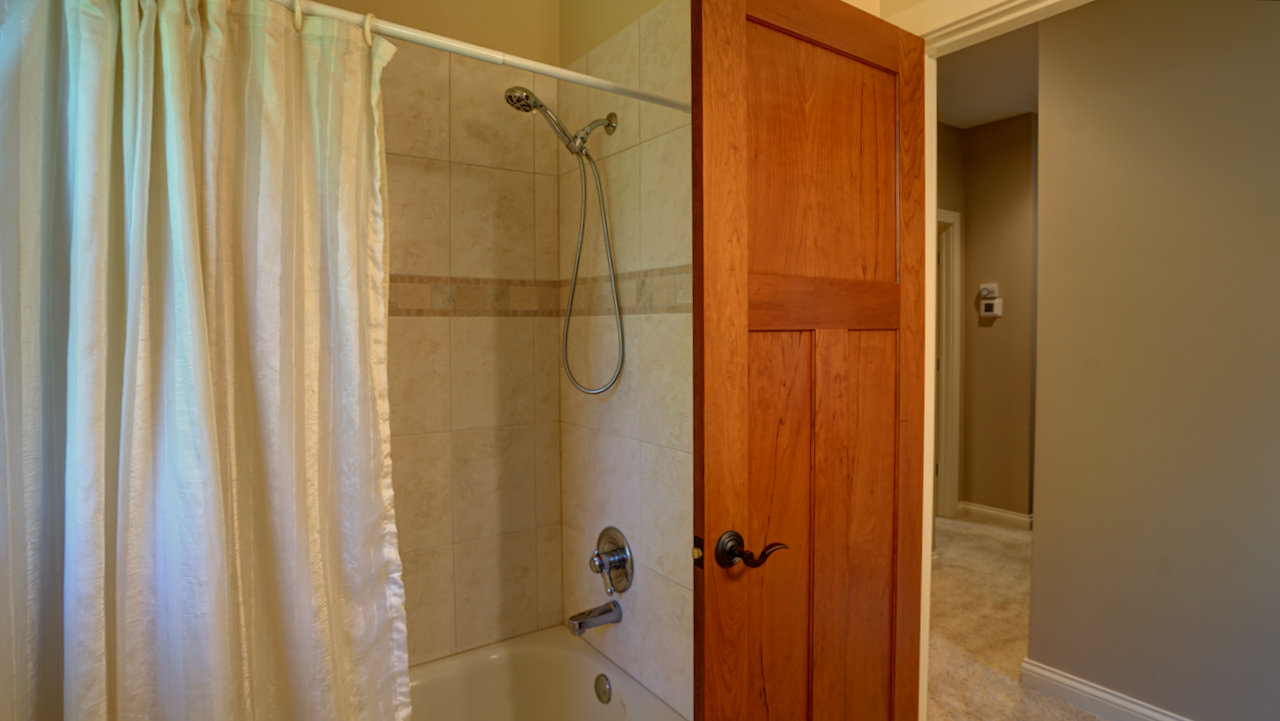 The 8x7 main guest bathroom is centrally located and features a full bath configuration with a dedicated shower setup.