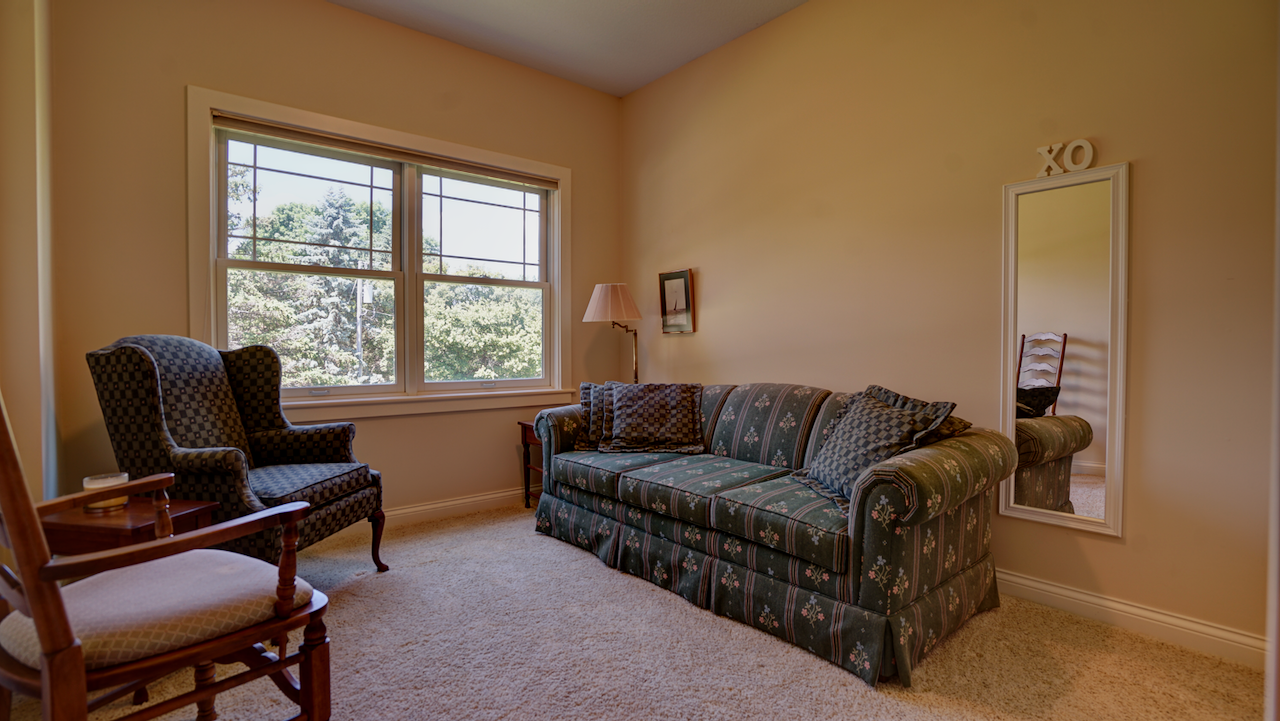 Bedroom 2 offers a 10x11 footprint on the west side of the home, featuring abundant natural light and generous closet space.
