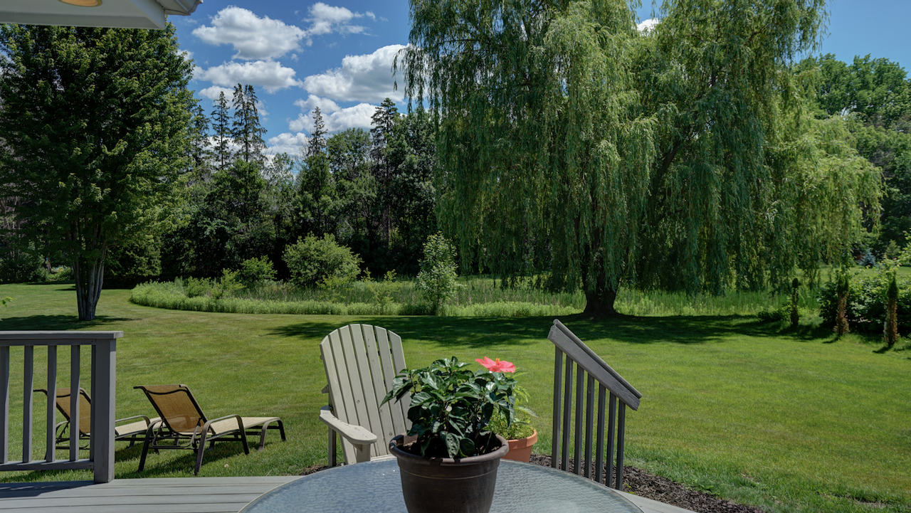 Step outside to the low-maintenance Trex-style composite deck, finished in a modern gray tone for effortless upkeep.