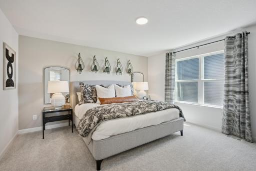 *Photo of model home, actual features may vary. Find your retreat in this stunning primary suite. Enjoy the exclusivity of a private bath and walk-in closet.