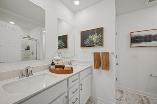 *Photo of model home, actual features may vary. An extension of the primary suite, this private and spacious bathroom contains a double vanity.