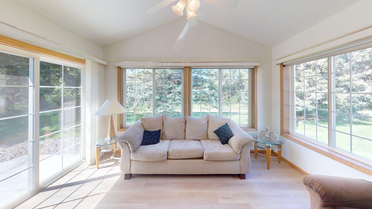 Sunroom w/vaulted ceiling and walkout to patio