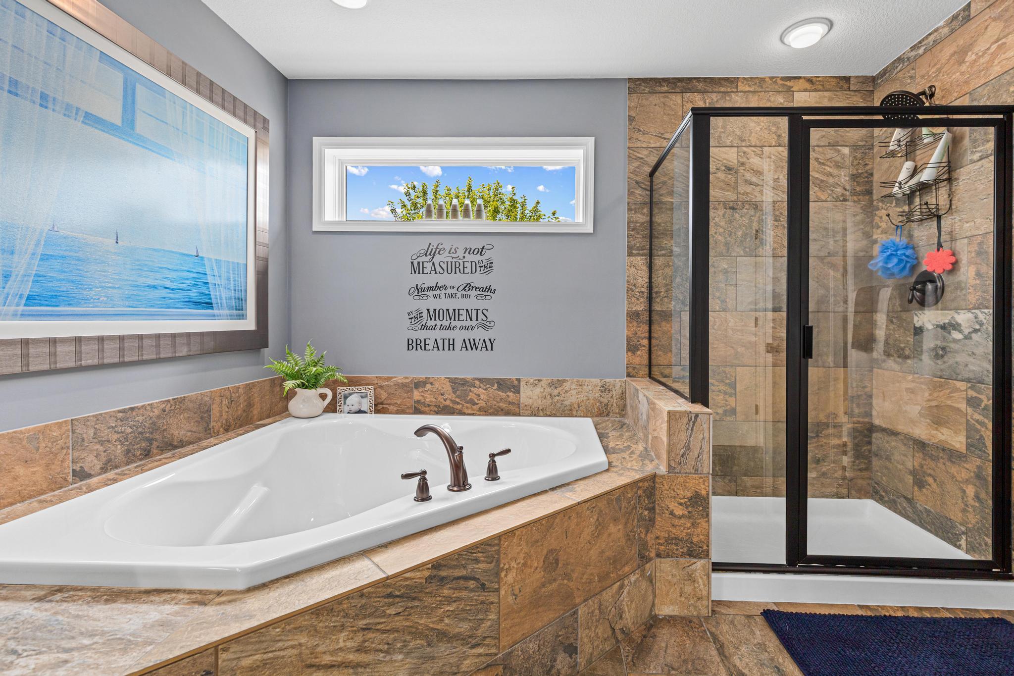 Primary ensuite with separate soaker tub and shower.