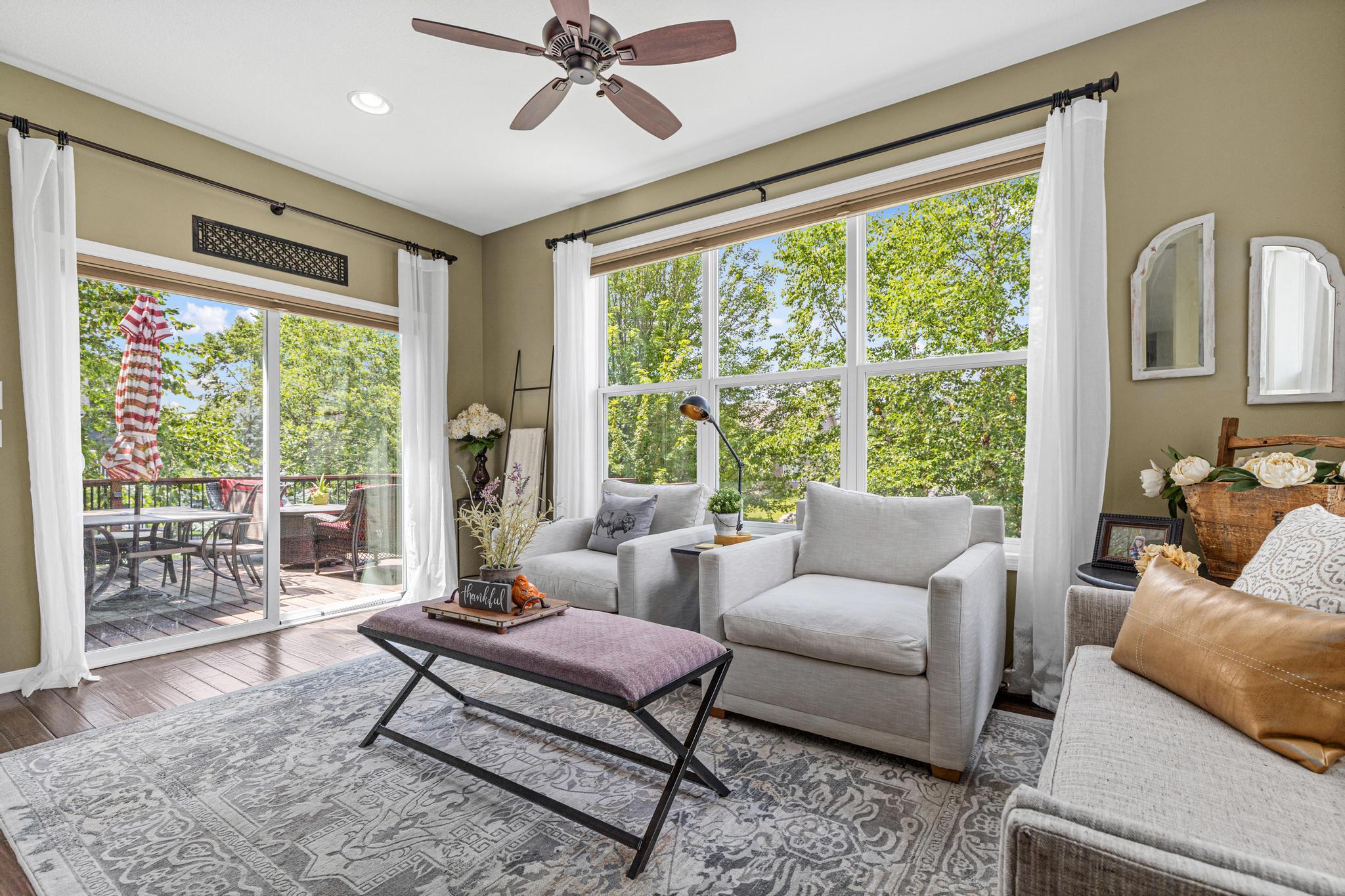 Cozy sun room with deck access.