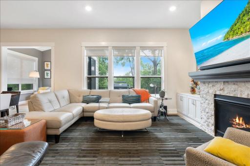 Gorgeous living room with gas fireplace and built in storage on each.