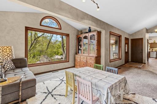 Living room has a large window that brings in lots of light.