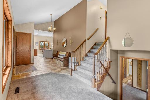 Stairs to upper level and lower level.