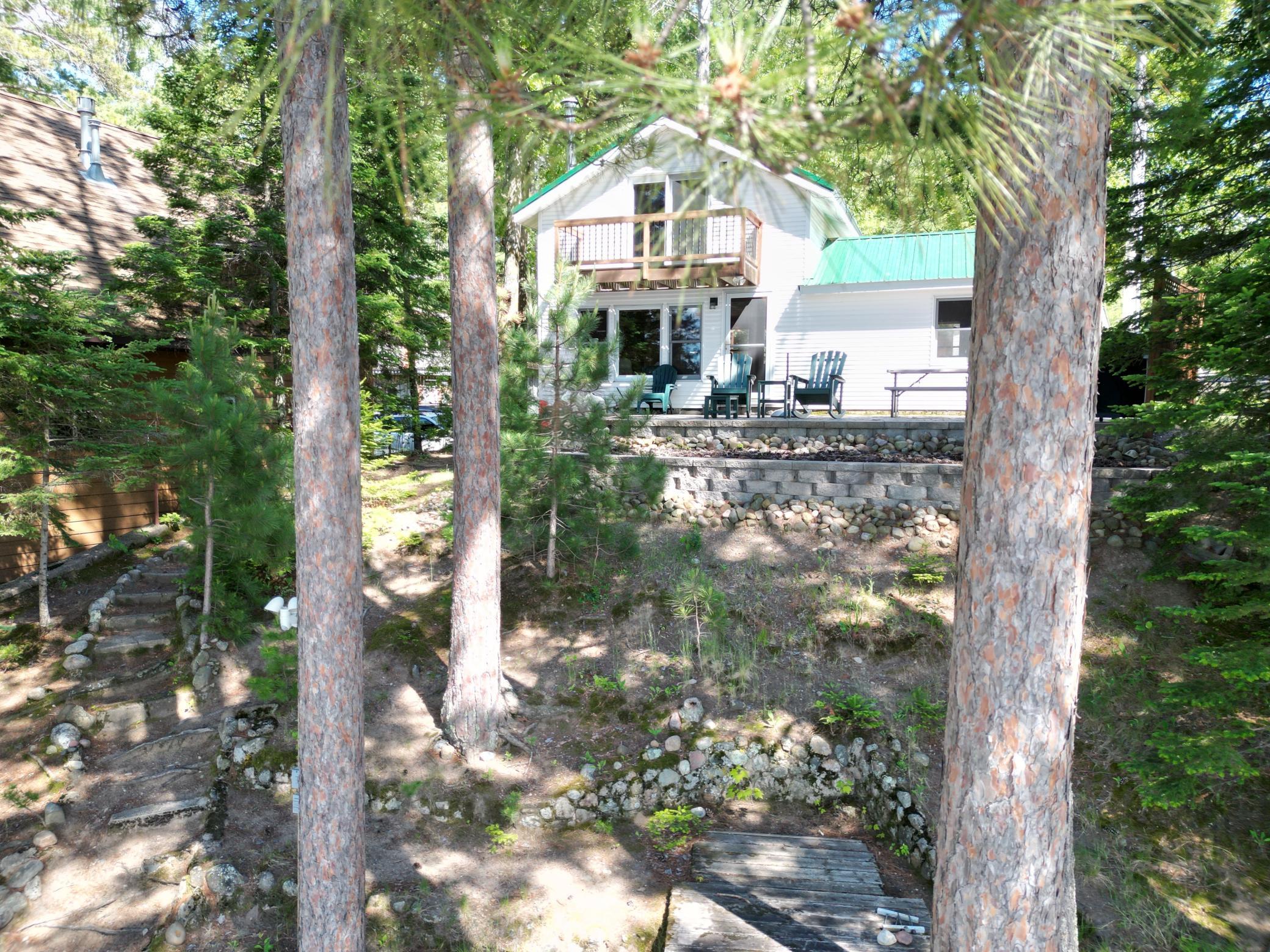 Nestled among the pines and hardwoods. Sellers are keeping the "By the Yard" patio furniture.