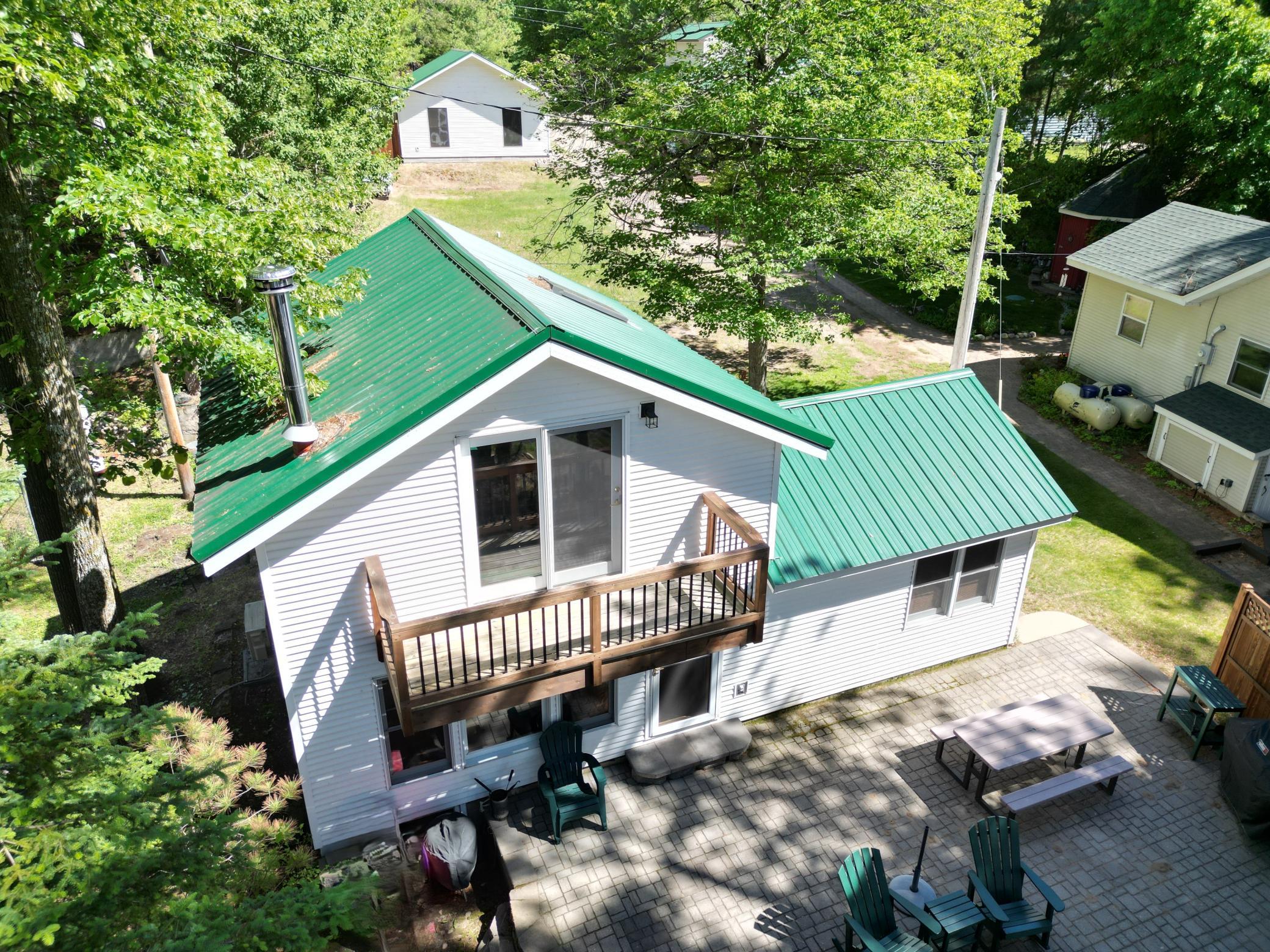 The upper deck was replaced a few years ago. You can access this deck from the loft area. This view shows you the large 40x24 garage in the back.