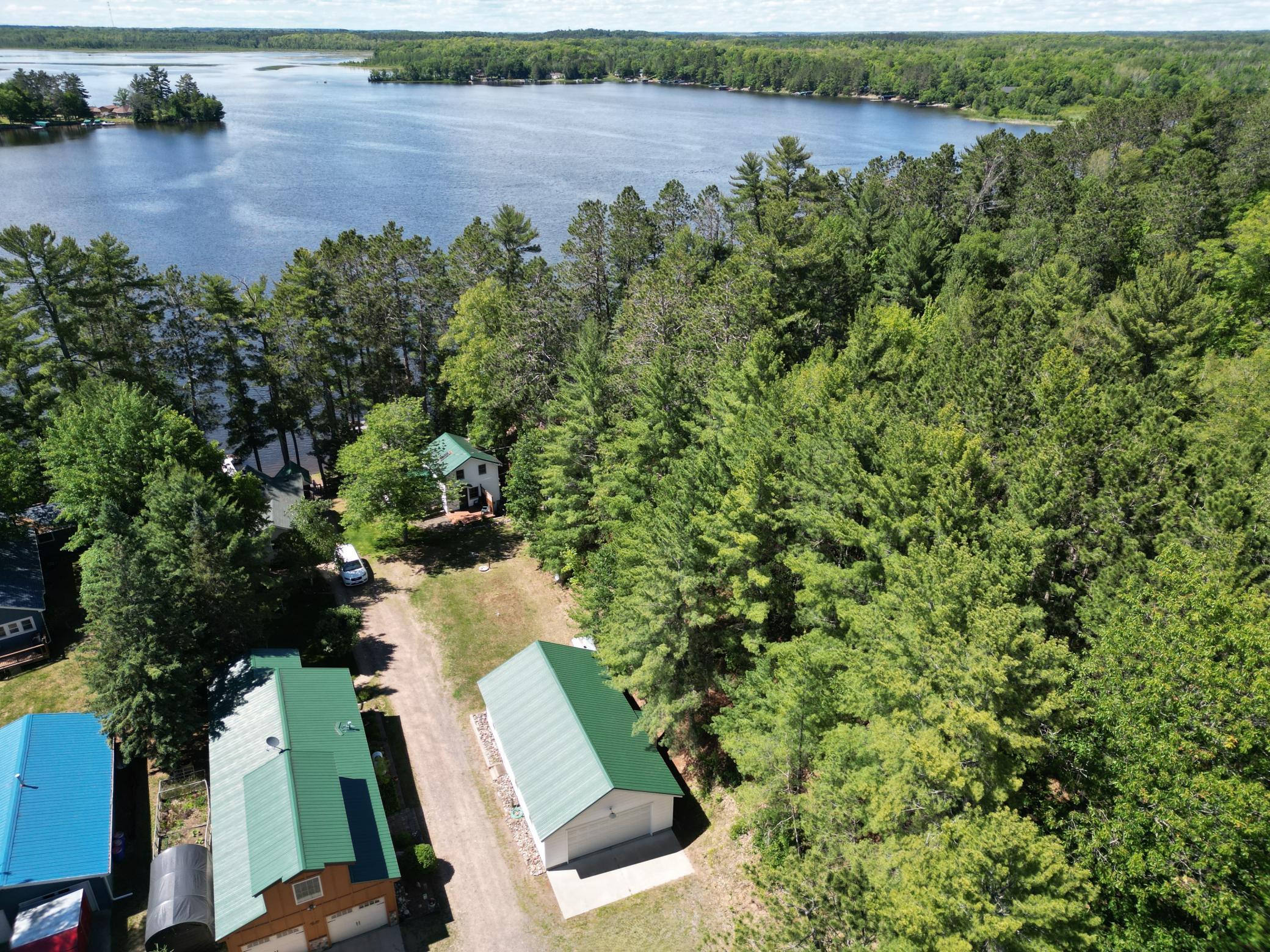 Stunning setting in a quiet bay on the shore of Lake Minnewawa.