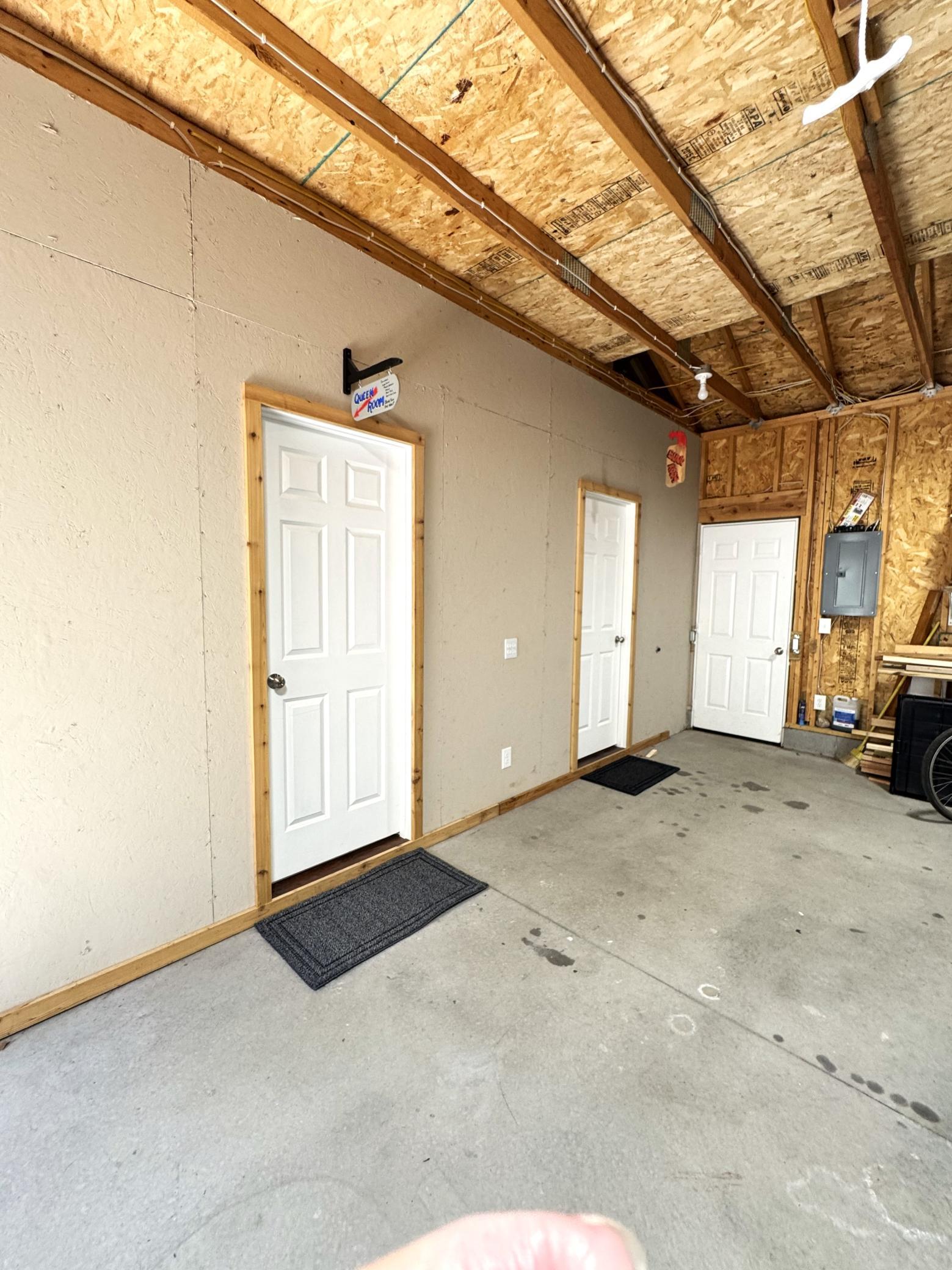 Another view...............lots of storage shelves and a work bench are included,