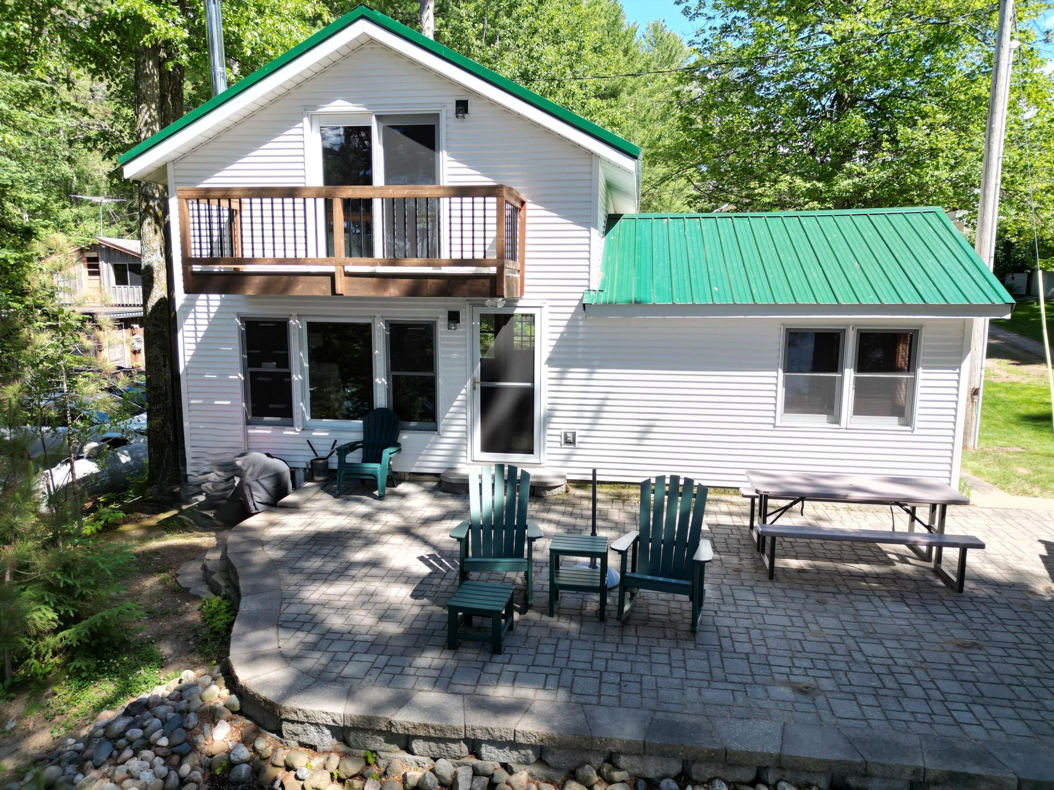 The home has a steel roof that was added a few years back. The cobblestone patio is a huge plus and gives you the perfect place to sit and enjoy the view with your morning coffee.