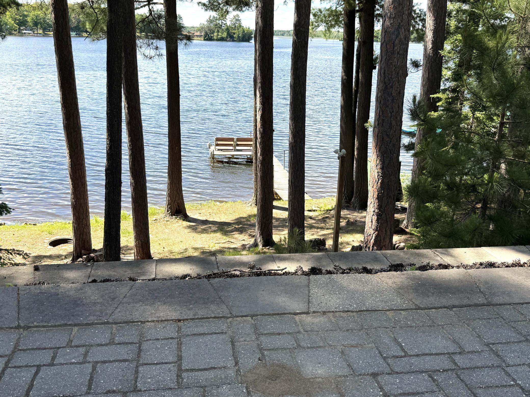 Close up view of the cobblestone patio and the serene view of the lake from there.