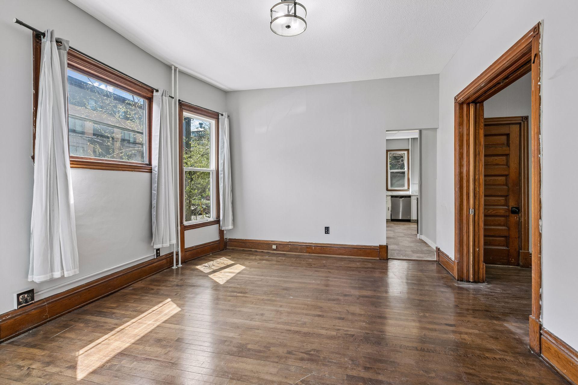 This classic property features three units spanning across 3,313 finished square feet. Unit 1 (main floor) includes a full kitchen, living room, two bedrooms, and a full bathroom.