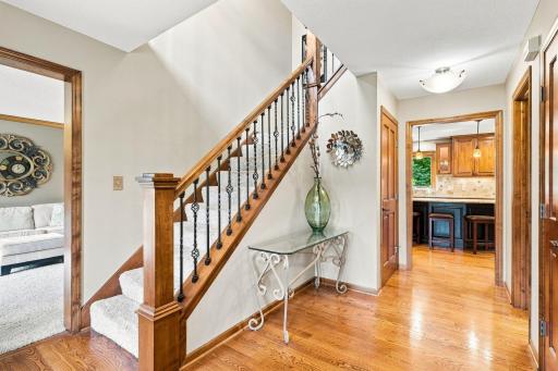 Entry way looking into the living room, stairs to the upper level and kitchen
