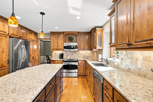 Kitchen with granite counter tops and apple storage