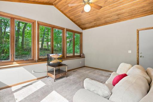 Sun room with large windows that let in a ton of natural light!