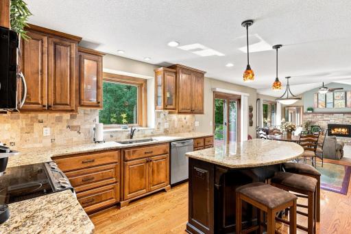 Kitchen with a large window over the sink looking into the backyard!