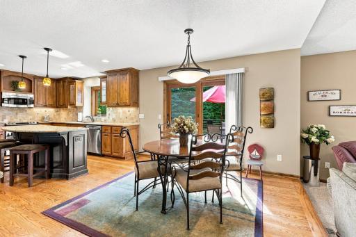 Breakfast nook with sliding glass door leading out to the deck