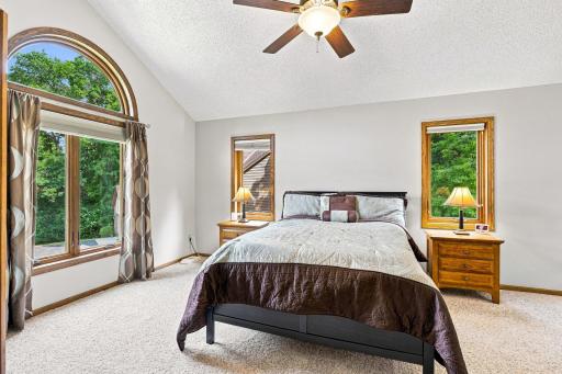 Primary bedroom with windows that frame the bed