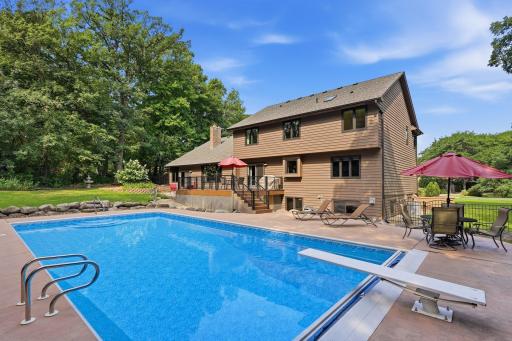 Gorgeous backyard with deck, pool and patio areas