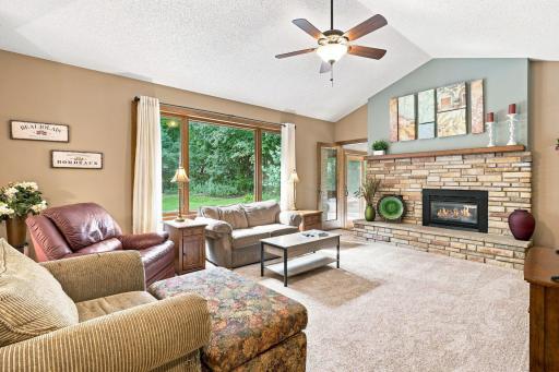Family room with gas burning fireplace and door to the sunroom