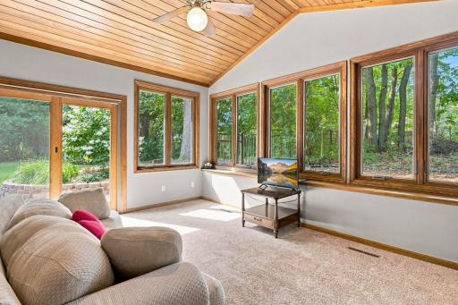 Sunroom that has a sliding glass door that leads to the backyard