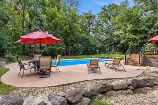 Patio area overlooking the pool and view of the tree house