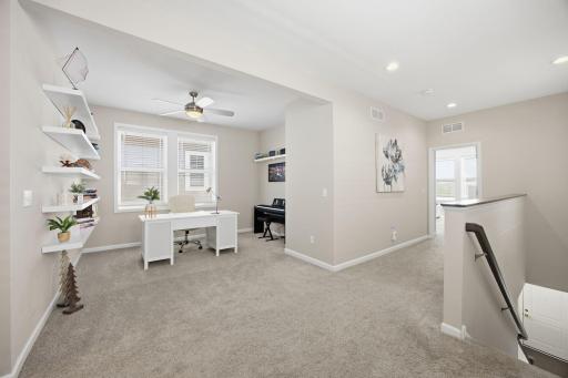 Upper-level loft adds flexible space for a home office, reading nook, play area, or second living space
