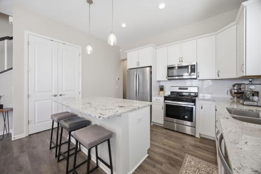 Spacious Maple Grove kitchen with granite countertops, generous counter space, and a functional island layout