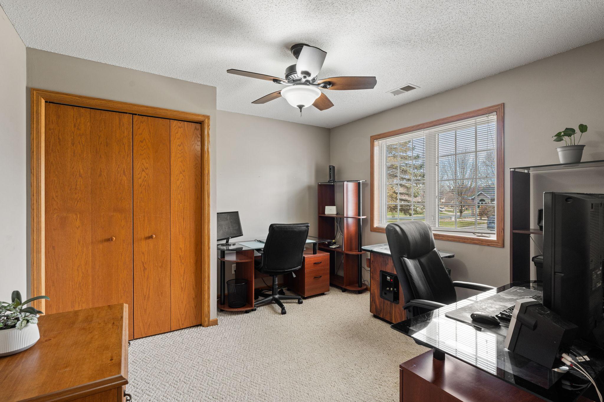 Main floor bedroom is currently used as an office. There is a bathroom directly across the hall... perfect for guests.