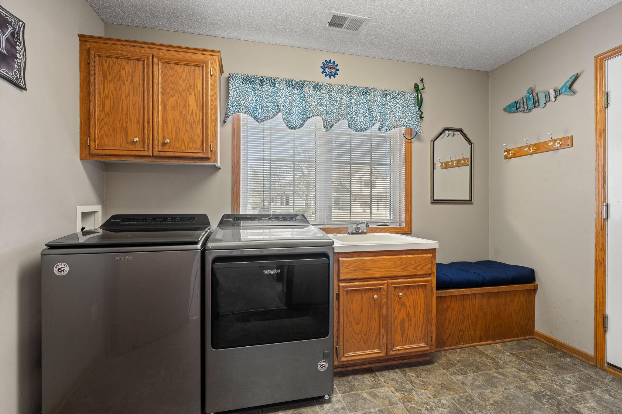 Laundry room upon garage entry.