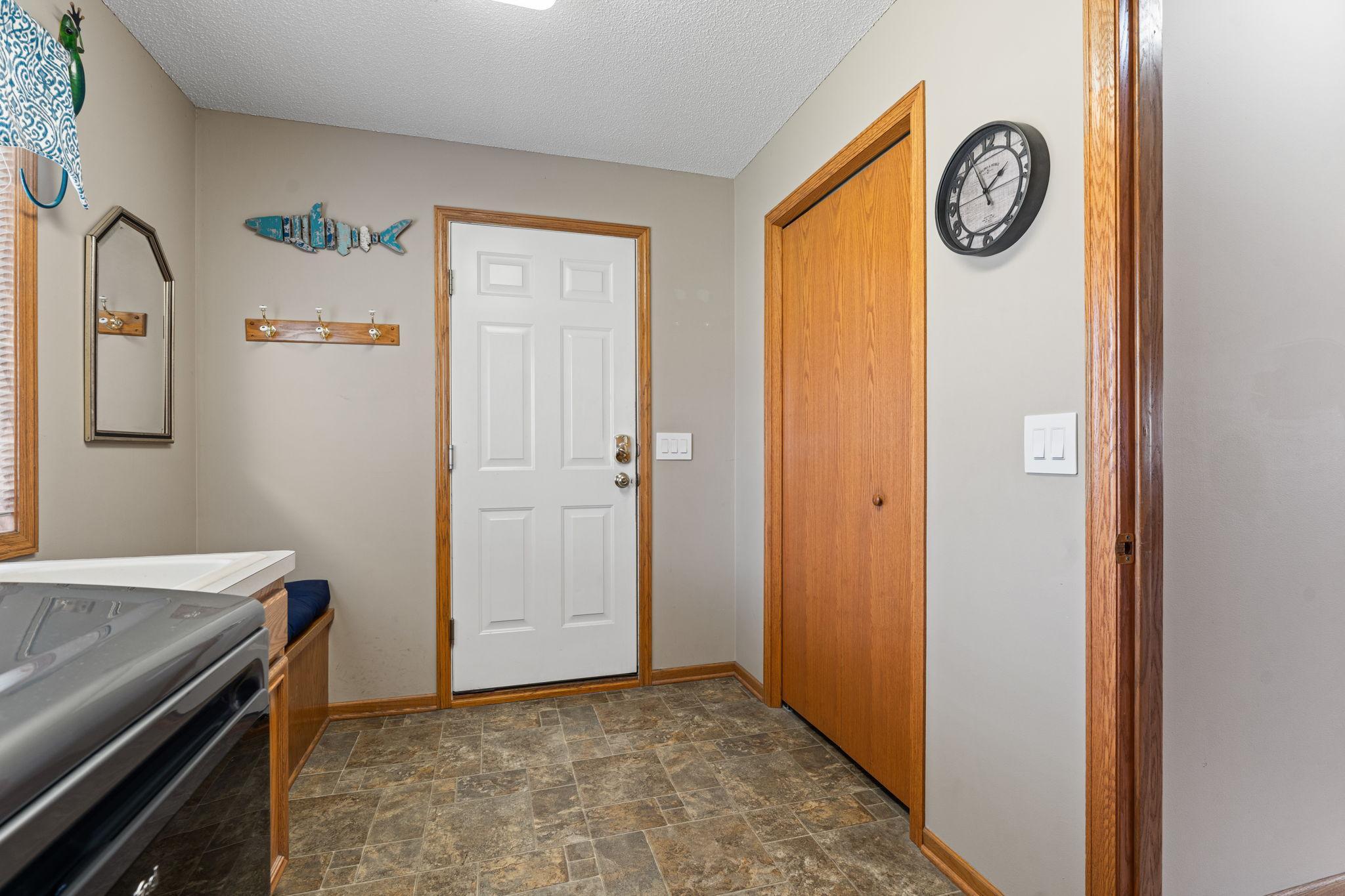 Large coat closet upon entry from garage with seat/bench for putting on shoes!