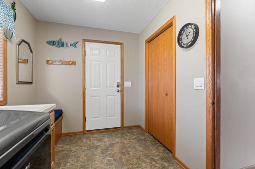 Large coat closet upon entry from garage with seat/bench for putting on shoes!