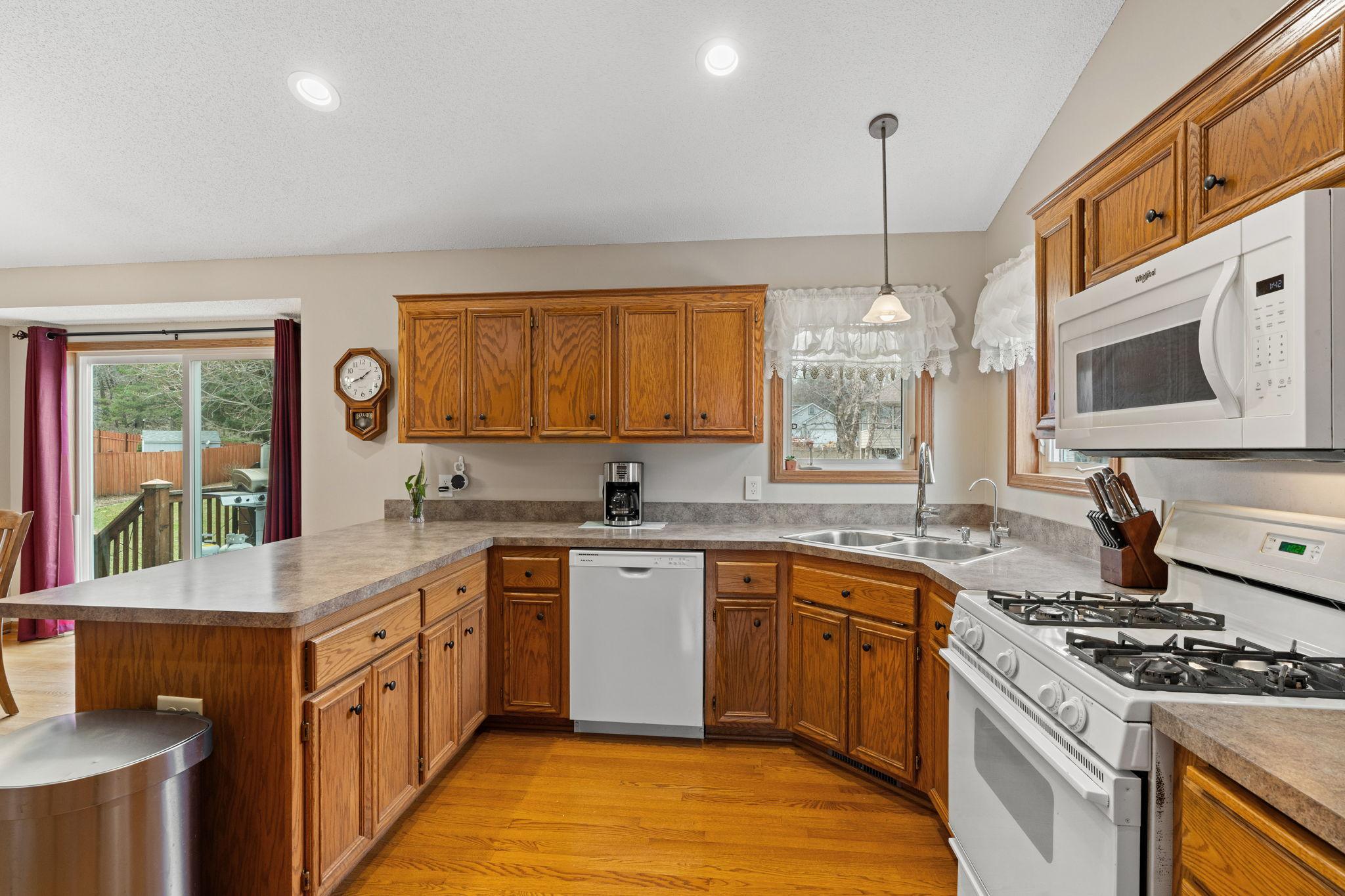 Nice sized kitchen with an abundance of cabinets.