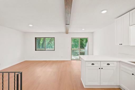 View from kitchen to family/dining room area to deck