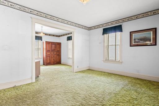 Spacious and full of natural light, this main-floor living area offers generous square footage and a flexible layout ready for your personal design vision.