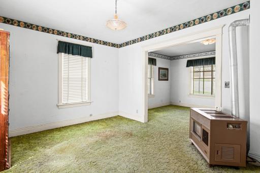 With multiple sightlines into connecting rooms, this living space is the heart of the home's floor plan ready to be transformed into a warm gathering space.
