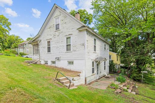 This side yard showcases mature landscaping and classic architectural lines, hinting at the character that continues throughout the home.