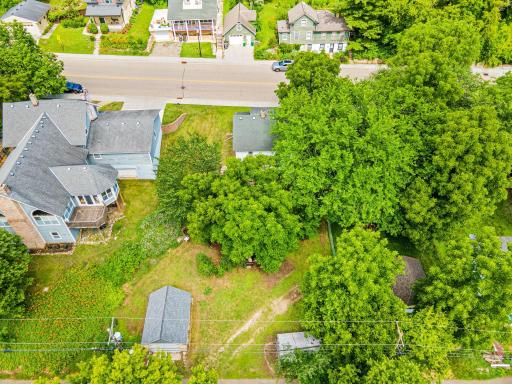 Surrounded by mature trees and situated on a spacious lot, this property offers a rare sense of privacy within the historic district.