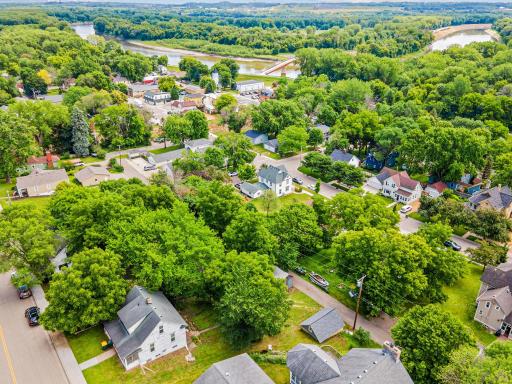 This sweeping aerial view captures the small-town charm of Carver, with its historic homes, scenic riverfront, and tight-knit community just steps from your door.