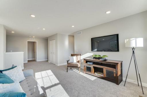 Upper-level loft area. Let the light shine in! Photo of model home, colors and finishes will vary.