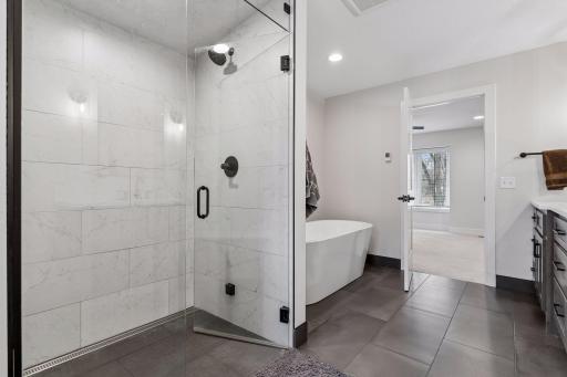 Full walk-in tiled steam shower and separate soaking tub . Heated floors too!