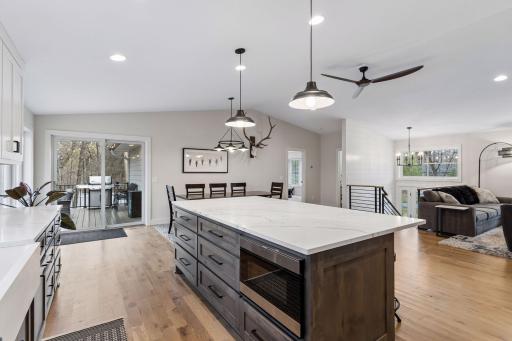 Kitchen walks out to the deck with natural gas grill hook up and maintenance free decking.