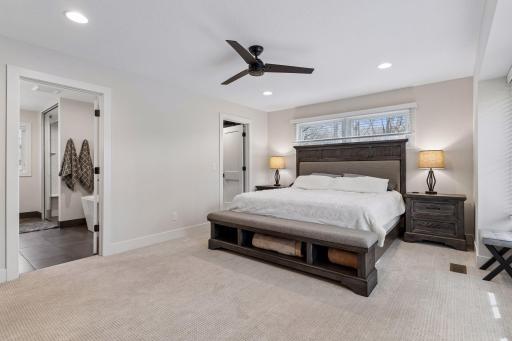 Primary bedroom with private bathroom and walk-in closet