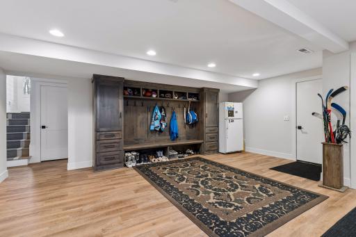 Dream mudroom - building in cabinets to keep you organized. Huge space with laundry too!