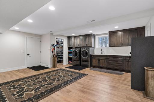 Luxury mudroom/laundry room with enterance from garage with walk in closet too!