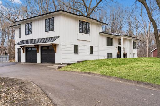 Welcome to 20750 Garden Road! Enlarged the foundation and created a second story with a 3 car garage.