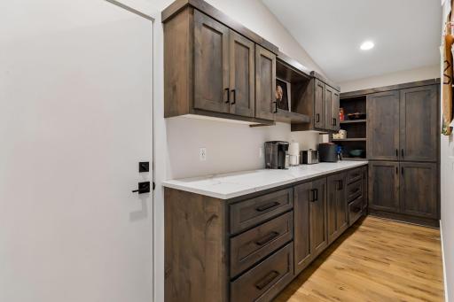 Large butlers pantry with custom cabinets & custom storage options
